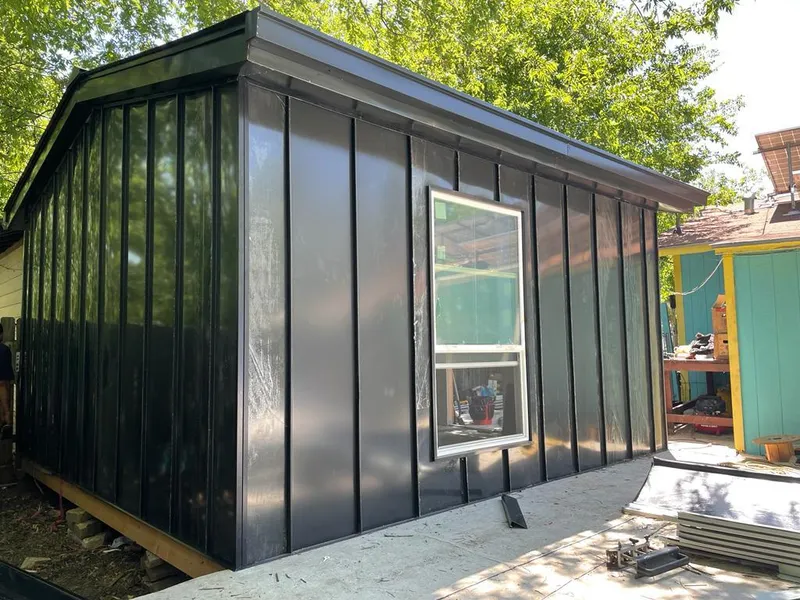 Black standing seam metal wall panels for Roof Inspection in Belfast